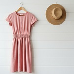 Pink Dress and Straw Hat Mockup on Wooden Wall – Elegant Fashion Template